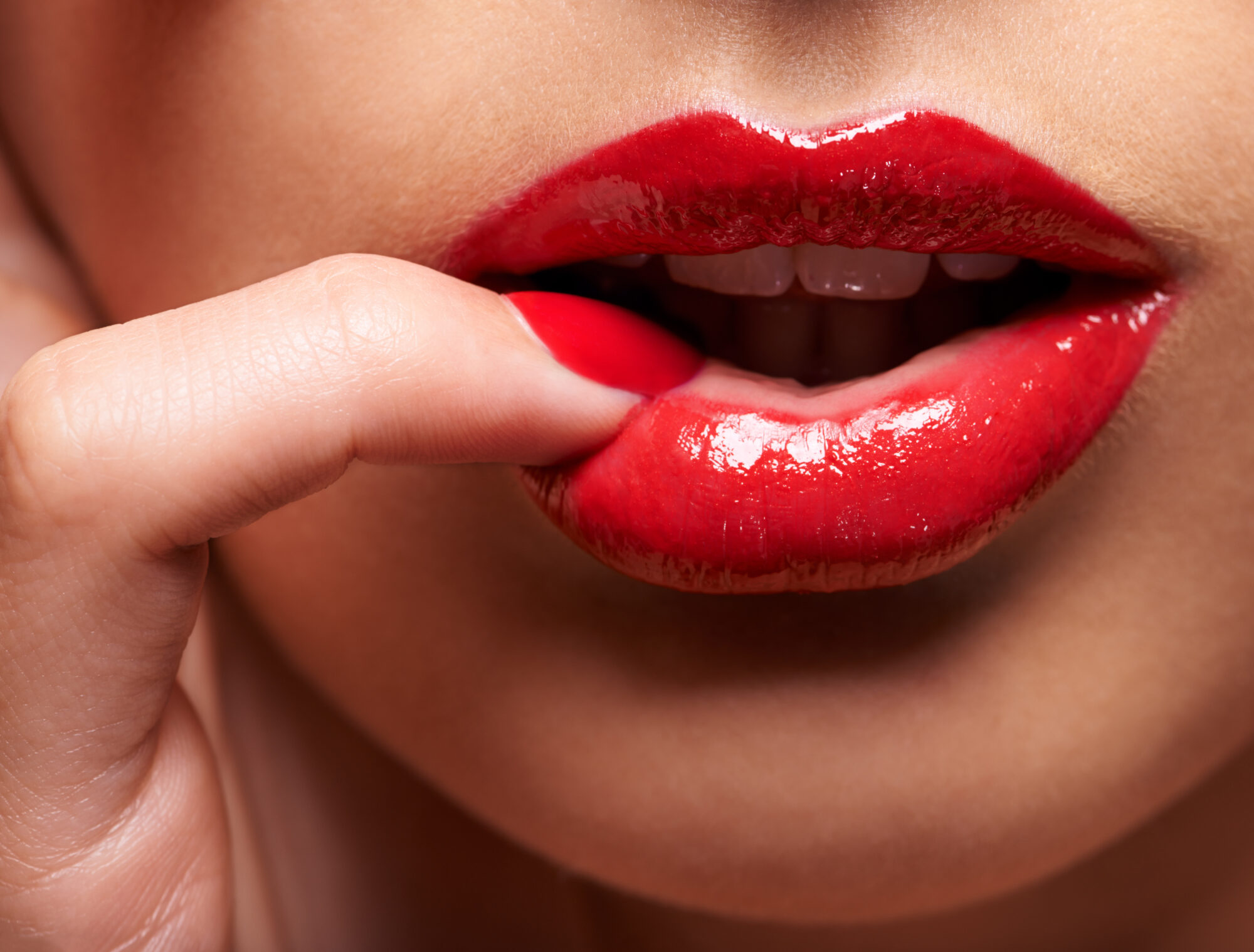Desire comes in red. Cropped shot of a woman pressing her finger Russian Lips Clinique Rivoli Massena 3